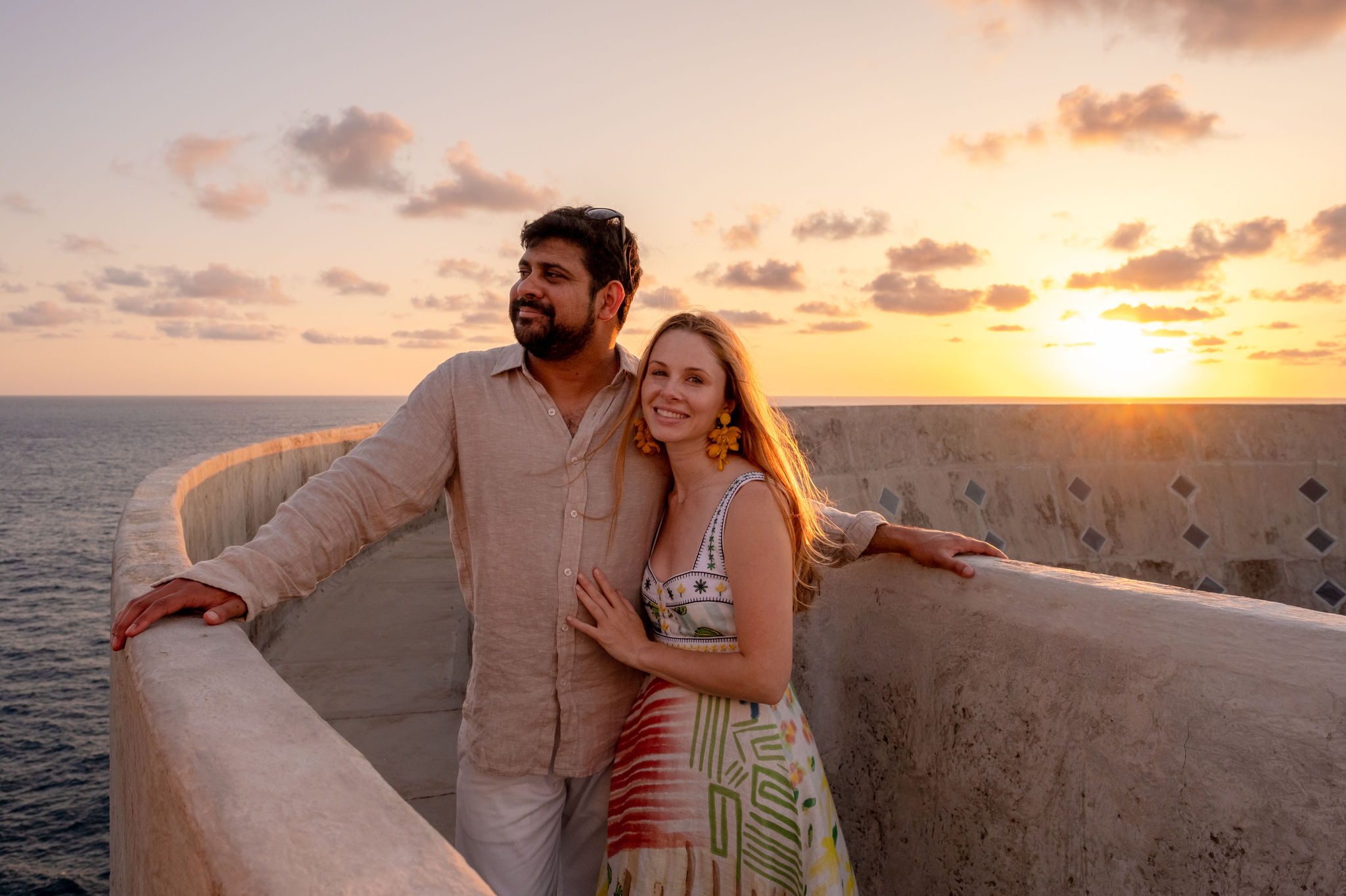 Zoe and Vik on terrace with ocean