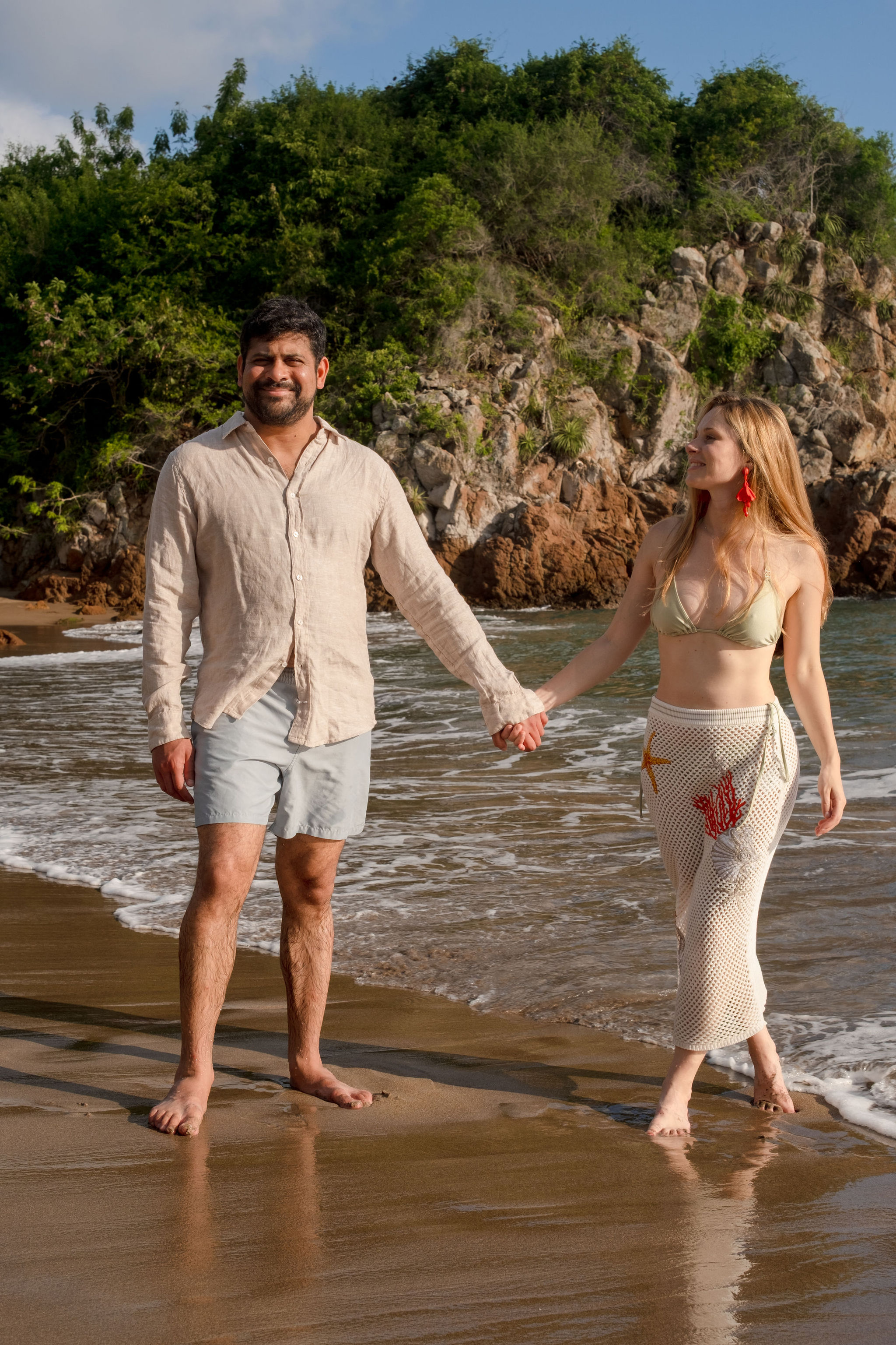 Zoe and Vik walking on beach